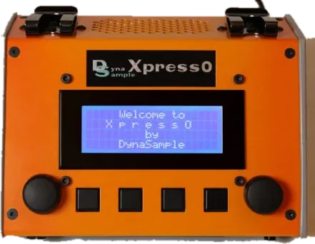 The orange DynaSample XpressO with its display, two knobs and four buttons.